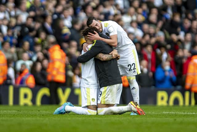 Rodrigo, Raphinha and Jack Harrison embrace at the final whistle after Leeds United beat Norwich City. Picture: Tony Johnson