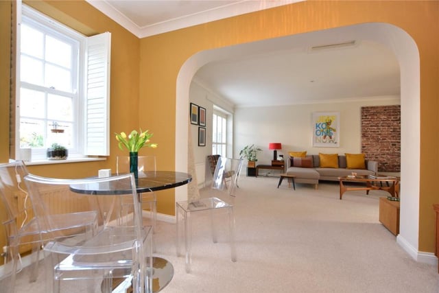 It leads into a spacious open plan 'L' shaped living dining room which has double French doors to the rear garden.