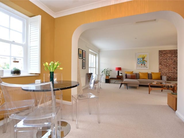 It leads into a spacious open plan 'L' shaped living dining room which has double French doors to the rear garden.