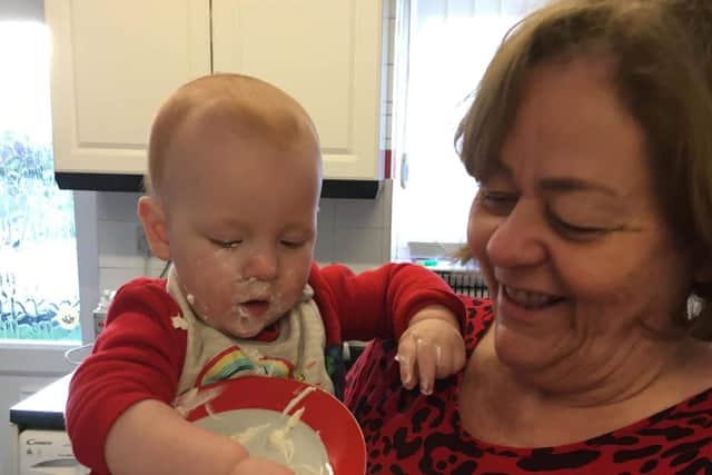 Sandra, pictured with her grandson Rory, has been left heartbroken after losing a life-changing device
