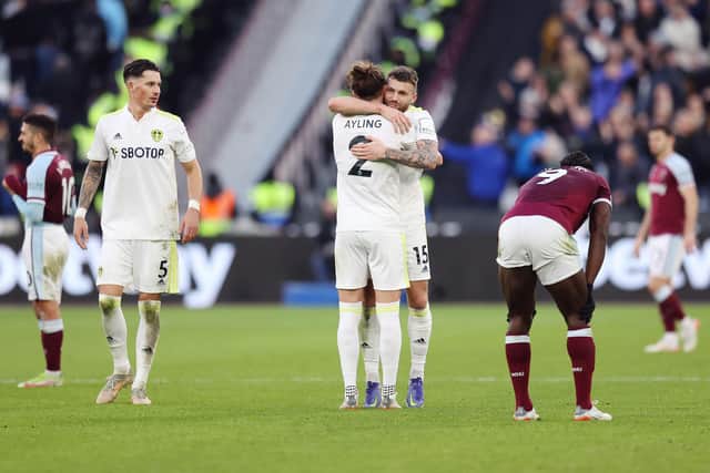 Stuart Dallas and Luke Ayling embrace after Leeds United's win over West Ham United. Pic: Alex Pantling.