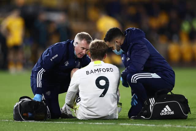 Leeds United striker Patrick Bamford receives medical attention.