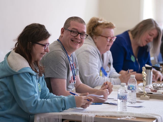 The judges write down their scores as they decide on who should be crowned