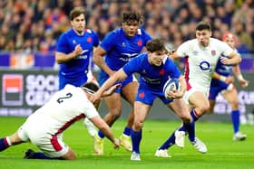 France's Antoine Dupont gets away from England's Jamie George to score his side's third try at the Stade de France Picture: Adam Davy/PA