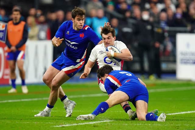 England's George Furbank is tackled by France's Antoine Dupont (right) at the Stade de France Picture: Adam Davy/PA