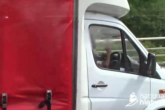 This shocking video shows the moment a brazen lorry driver caught using his mobile phone while not wearing a seatbelt gives the police the middle finger on the A1 near Leeds.
SWNS