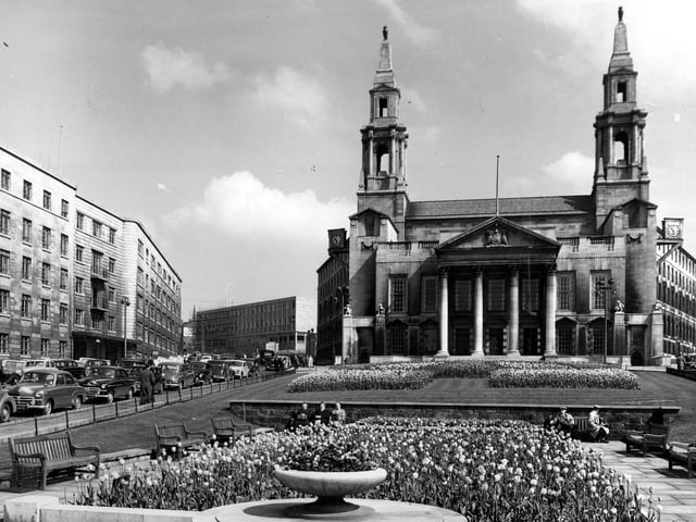 Leeds Civic Hall with the Leeds Polytechnic under construction to the left. Cars are parked in Calverley Street, left, and Leeds General Infirmary is at the left edge. The Civic Gardens in the foreground were later dedicated to Nelson Mandela in support of his struggle against apartheid.