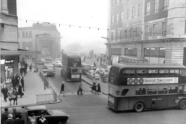 A view looking along Woodhouse Lane from The Headrow in January 1966. Lewis's department store is on the right. A no-entry buses only scheme can be seen operating. This area has now been redeveloped as the pedestrian only Dortmund Square.