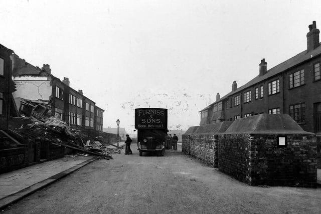 A view down Model Road in Armley after the air raids of March 15 showing the devastation caused by bombs.