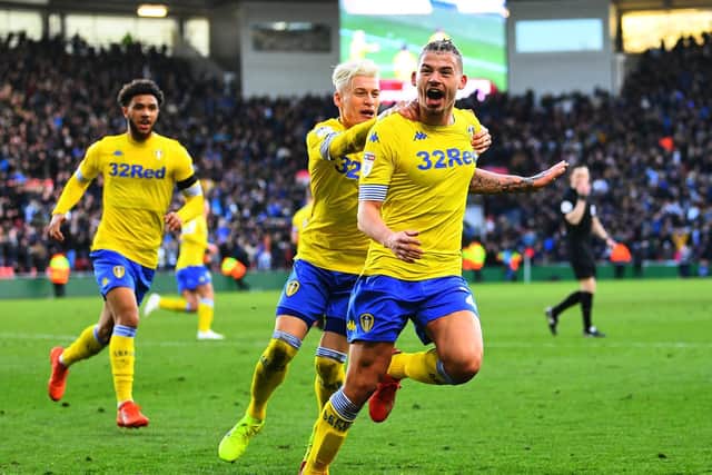 Leeds United midfielder celebrates with Gjanni Alioski. Pic: Jonathan Gawthorpe.