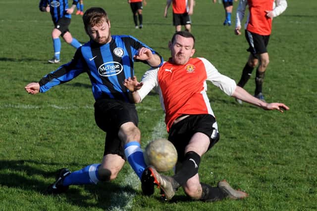 Daniel Bridges, of Altofts, goes toe to toe with Old Centralians' Aaron Rothery. Picture: Steve Riding.