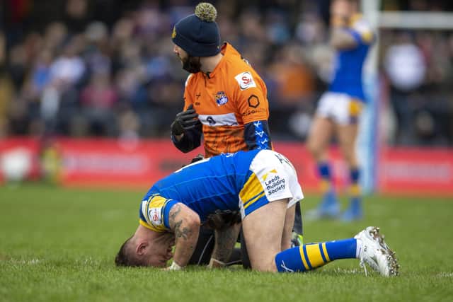 Richie Myler receives treatment early in the first half of Leeds Rhinos' season-opener against Warrington. Picture: Tony Johnson.
