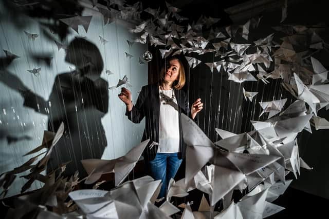 Leeds City Museum's new display of origami butterflies. Pictured is Cora Presley, Head of Nursing for Adult Critical Care Team.