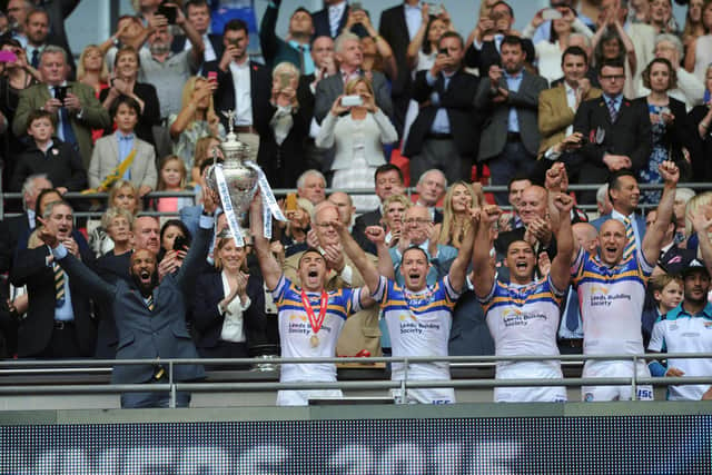 Jamie Jones-Buchanan and Kevin Sinfield lift the Challenge Cup at Wembley in 2015. Picture by Steve Riding.