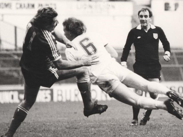 Brendan Ormsby goes for a diving header.