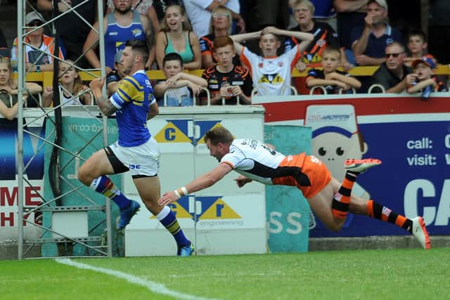Tom Briscoe scores his second try for Leeds in their 2018 defeat at Castleford which was Kevin Sinfield and James Lowes' first match in charge. Picture by Tony Johnson.
