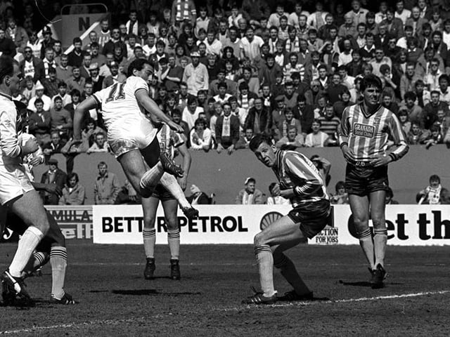 Defender David Rennie rises high to give Leeds United an early lead.