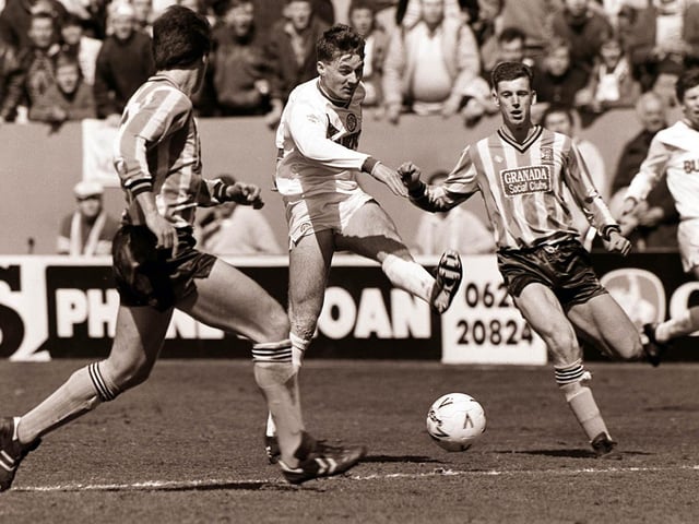John Sheridan fires towards goal.