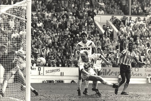 Neil Aspin and goalkeeper Mervyn Day try unsuccessfully to block a shot from Coventry City substitute Micky Gynn (out of picture).