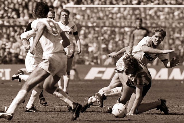 Ian Biard tangles with Coventry City's Brian Kilcline.