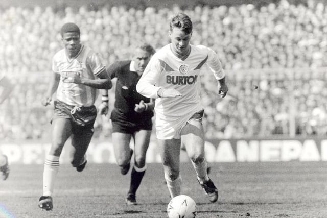 John Sheridan in full flight as he is chased by Coventry City's Lloyd McGrath and referee Roger Milford.