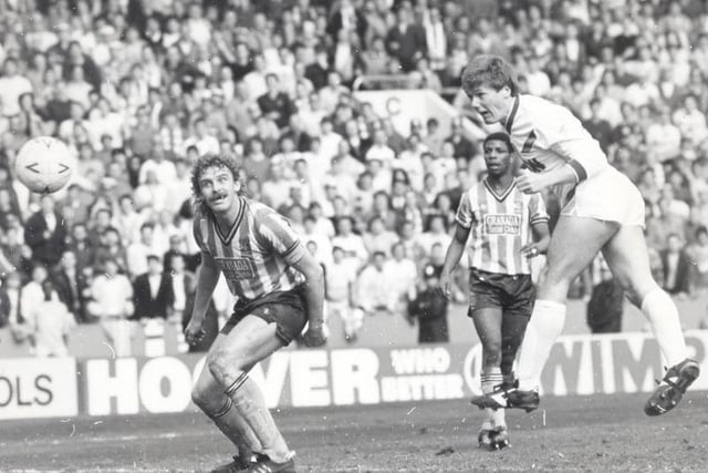 Keith Edwards heads home for Leeds United as Sky Blues defender Brian Kilcline looks on.