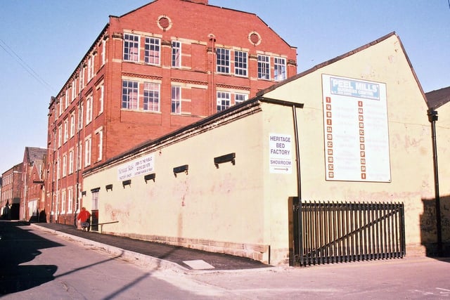Peel Mills, on both sides of Morley's Commercial Street, was divided into many separate business establishments after the textile mill had closed down. Most of the buildings were left standing, one of the most attractive ones being the tall red brick one shown here in December 1994.
