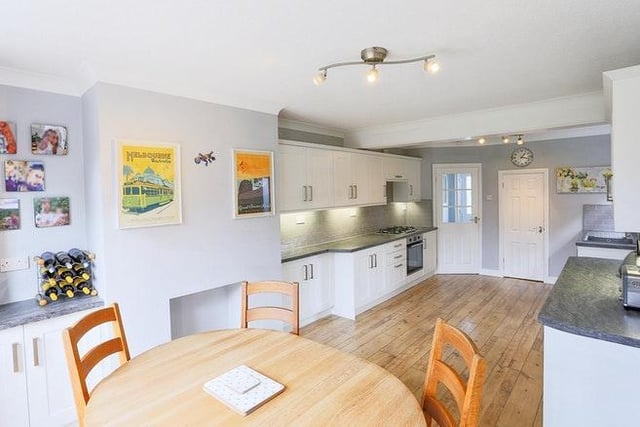 The room is well fitted with a selection of high quality cabinets and work surfaces along with a range of integrated appliances. French doors lead to the garden and decking area. The kitchen also includes a spacious pantry.