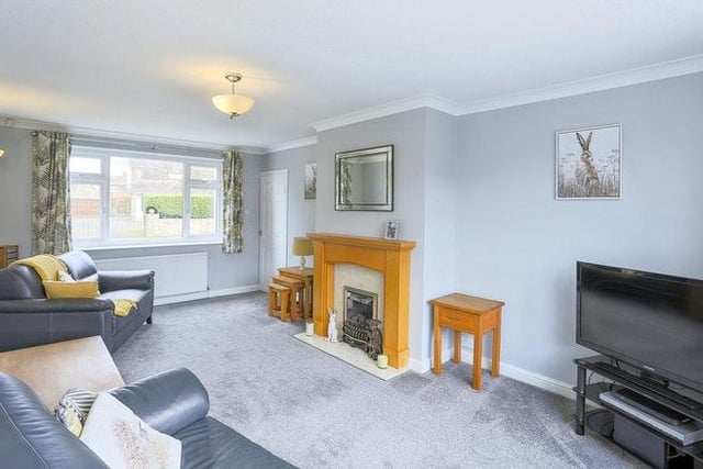 The Lounge is a lovely sized room measuring 20' x 11'5" with a feature central fireplace, fitted gas fire and double glazed windows to the front and rear.