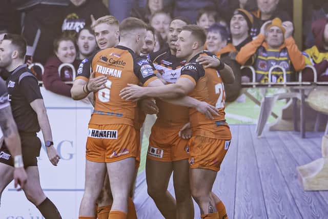Castleford's Greg Eden, right , is congratulated after scoring against Hull FC. Picture: Allan McKenzie/SWpix.com.