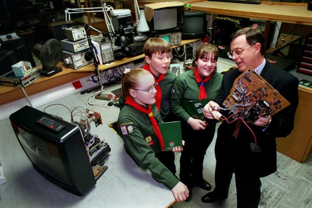 Scouts from the 8th South Leeds (Carlton Group) during a visit to the Comet Customer Service Centre in Leeds. The firm was sponsoring the Scout Electronics Badge. Pictured, from left, is Holly Peters, Chris Brown, Vikki Patterson and quality assurance manager Stewart Price.