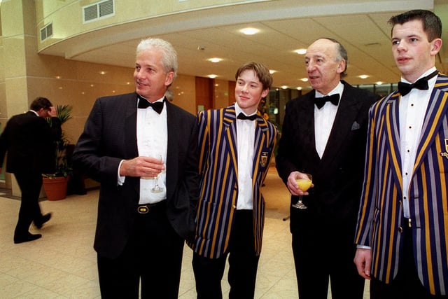 Cricket star David Gower and Judge Brian Walsh Q.C., D.L., The Recorder of Leeds, chat with Leeds Grammar sixth form students Oliver Granes (left) and Ian Clemmence, at a special dinner to raise funds for a sports pavilion at the school.