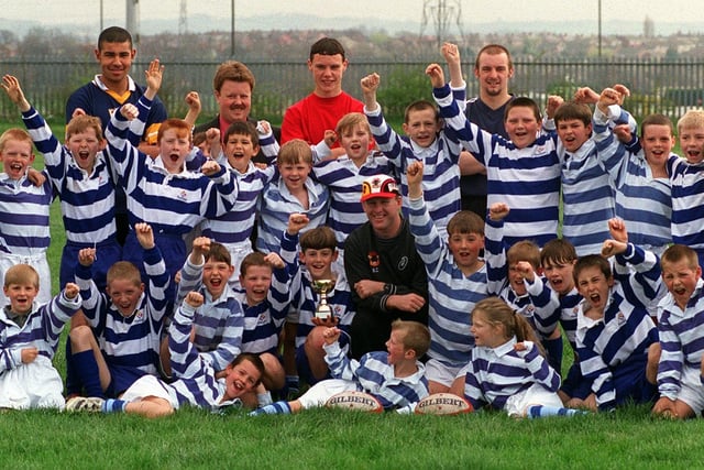 Clapgate Primary School rugby league team were celebrating after winning the  Yorkshire U-11's Cup. Pictured with team back left to right Chev Walker (signed for Leeds Rhinos), Richard Dodd (Deputy Head), Michael Lyons (signed for Wigan) and Antony Breeze (teacher). Front centre Bradford Bulls player Wayne Collins.