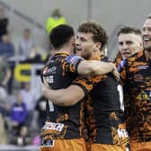 Castleford Tigers' George Lawler is congratulated on his try against Leeds Rhinos. Picture: Allan McKenzie/SWpix.com.