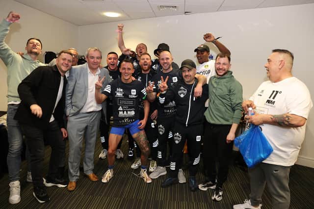 PARTY TIME: Leeds United captain Liam Cooper, left, and Luke Ayling, back, join in the celebrations after Josh Warrington's defeat of Kiko Martinez to become IBF featherweight champion of the world. Picture By Mark Robinson Matchroom Boxing.