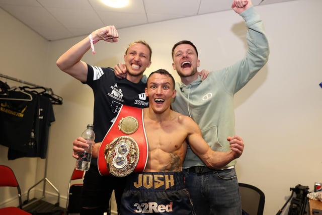 Josh Warrington with Leeds United duo Luke Ayling and Liam Cooper after becoming IBF featherweight champion of the world. Picture By Mark Robinson Matchroom Boxing.
