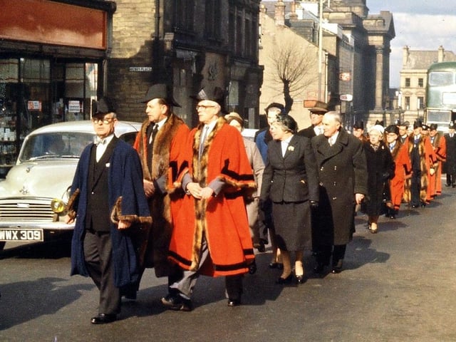 The final part of the civic procession from the Town Hall to the Central Methodist Church. The councillors have just walked past and this final section includes the Aldermen on the Council, some magistrates and West Riding County Councillors, with the Mayor and Town Clerk plus the civic regalia.