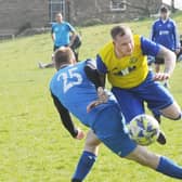 Runaway Yorkshire Amateur League Division 3 leaders Stanningley Old Boys beat bottom club Hanging Heaton Reserves 9-0 with Tom Stewart, pictured being  brought down by defender Danny Galpin, scoring three of them. Picture: Steve Riding.