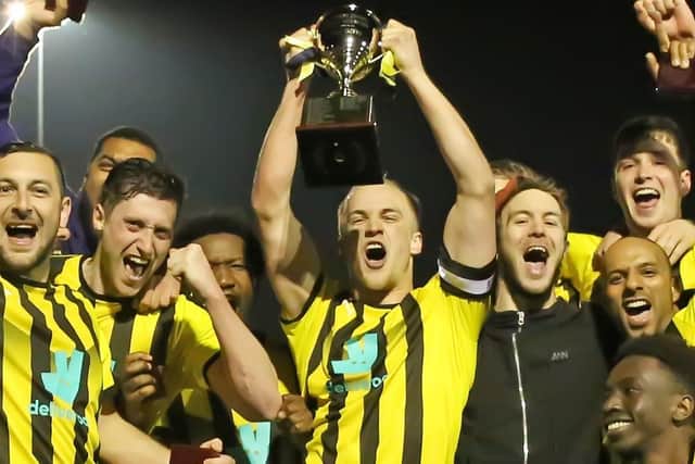 Beck & Call captain Matt Stanley lifts the West Riding County FA Sunday Trophy. Picture: Beck & Call.