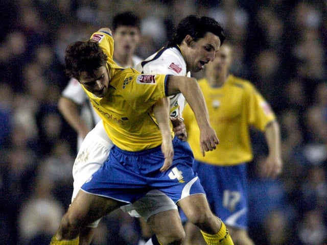 Jonathan Douglas and Preston's Danny Pugh battle for the ball.