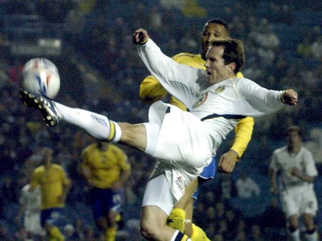 Eddie Lewis flicks on the ball as Preston's Frank Songo'o closes in.