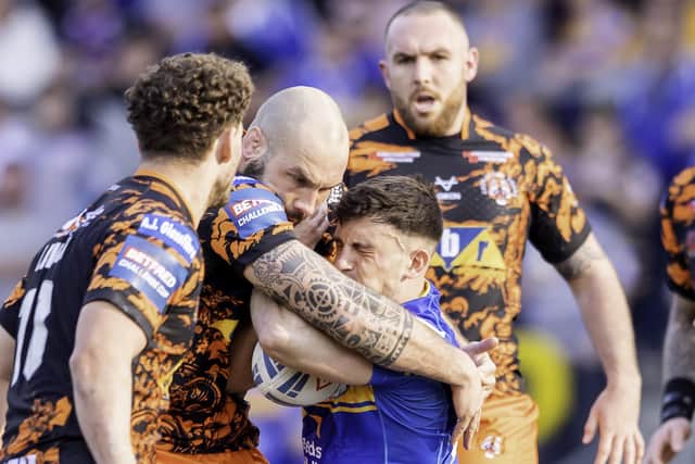 Leeds Rhinos' Liam TIndall is tackled by Castleford Tigers' George Griffin. Picture: Allan McKenzie/SWpix.com.