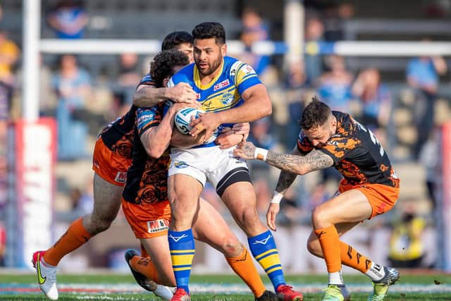 Rhyse Martin's run is halted by Castleford's George Lawler and Gareth O'Brien. Picture: Allan McKenzie/SWpix.com.