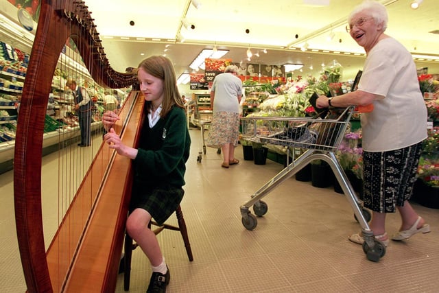 This is Millie Womack who was entertaining shoppers at Sainsbury's in Moortown with her harp playing in June 1999. Her efforts raised hundreds of pounds for the NSPCC.