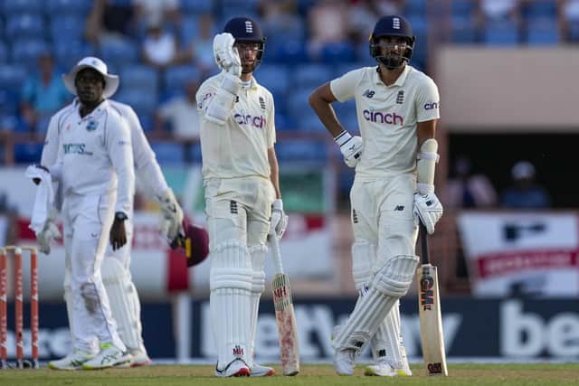 England's Saqib Mahmood, right, and team-mate Jack Leach performed batting heroics in England's first innings in Grenada - but it couldn't prevent defeat. Picture: AP/Ricardo Mazalan