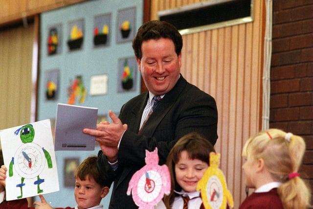 Head teacher Jim McHugh at Archbishop Cranmer C of E Primary with children during the school assembly in November 1996.