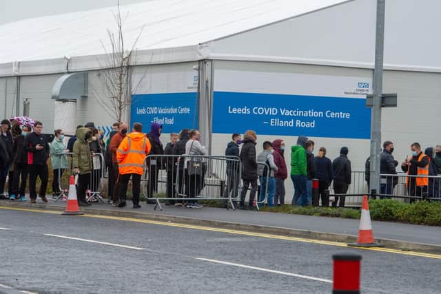 Long queues at the Leeds COVID Vaccination Centre in December 2021. Picture: James Hardisty