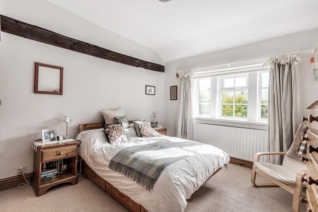Upstairs are three double bedrooms, each with traditional features such as exposed beams.