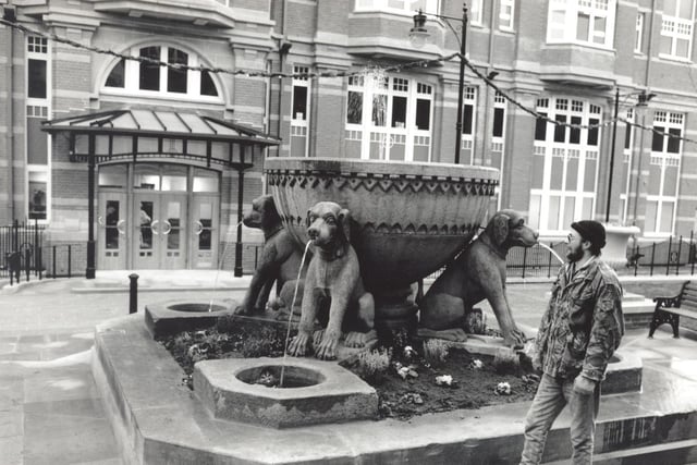 This eight foot reclaimed Victorian fountain with four massive stone dogs pictured 
in December 1991  was the centrepiece of a Boar Lane office development, one the site of the former Trevelyan Temperance Hotel.