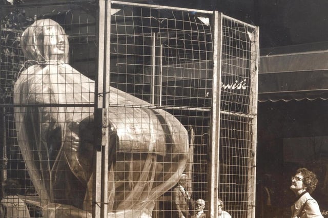 This 10ft tall statue swathed in plastic and protected by a wire cage is the Dortmund Drayman pictured in September 1980. It was a gift from the city of Dortmund to commemorate the 10th anniversary of the twinning of the two cities